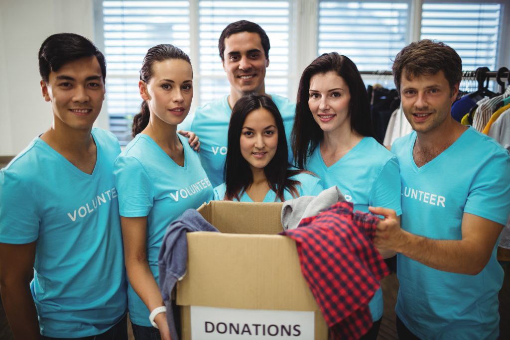 group of volunteers with donation box